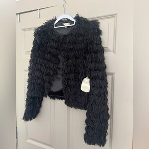 Atr’d state black textured top size XS brand new with tag still on. Never worn